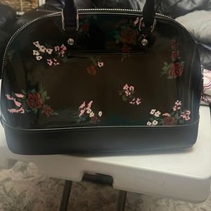 Coach small floral black purse. Great condition.  Used twice.